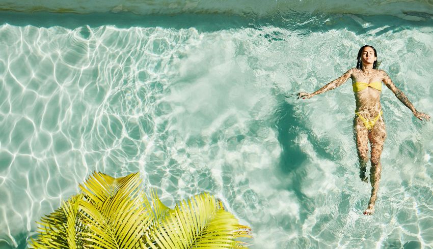woman floating in the pool